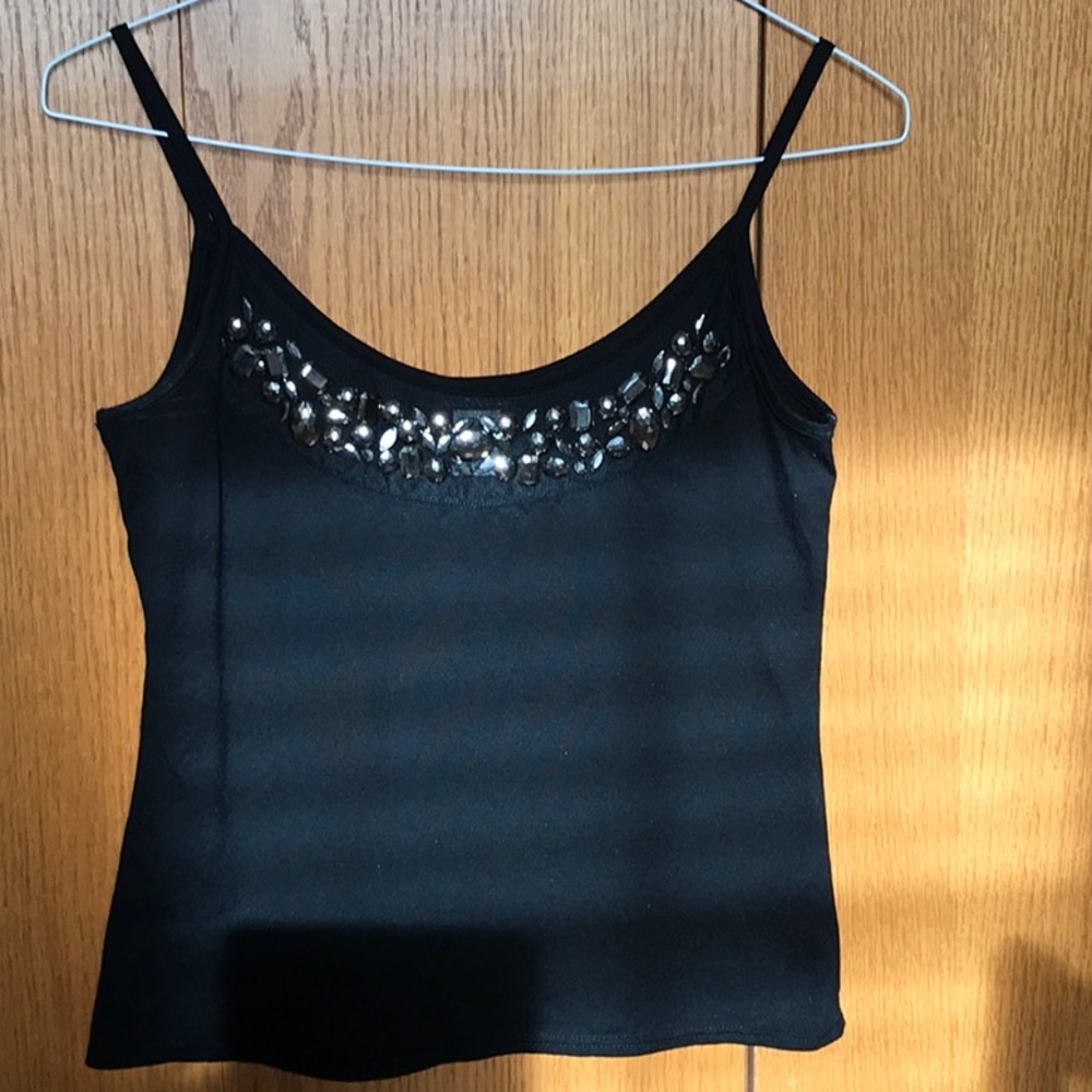 Ladies black, sleeveless top with rhinestone embellishments. Size small.